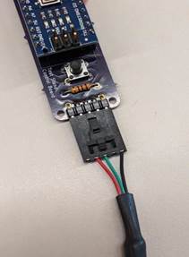 A small electronic device with wires

Description automatically generated